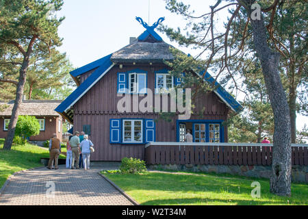 Thomas Mann summer house, old Lithuanian traditional wooden house in Nida, Lithuania, Europe, with tourists visiting Stock Photo