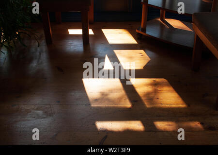Warm beautiful light and shadow from window on the wooden floor Stock Photo