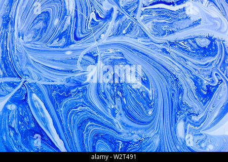 Blue abstract background with marble pattern. Marble liquid acrylic texture. White and blue acrylic paints. Fluid art-marble effect. Stock Photo