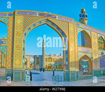 ARAN-O-BIGDOL, IRAN - OCTOBER 23, 2017: The view on Imamzadeh Helal Ali Holy Shrine through its beautiful arched path, decorated with Islamic tile pat Stock Photo