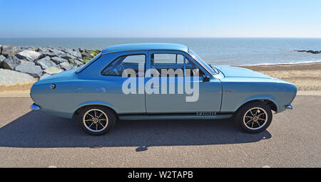 Classic Silver Ford Escort Motor Car Parked on Seafront Promenade. Stock Photo