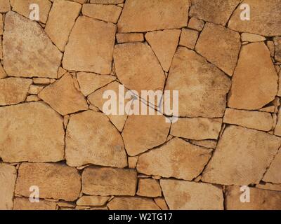 brown stone wall texture, abstract background, pattern of nature stone wall Stock Photo