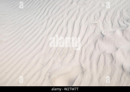 Sand wind waves, ripples, wavy lines on a beach. Stock Photo