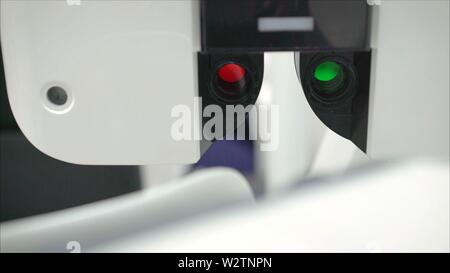 Microscopic apparatus for checking eyesight close-up. Ophthalmology and treatment of eye diseases. Eye clinic, Optometrist. Eye sight device Stock Photo