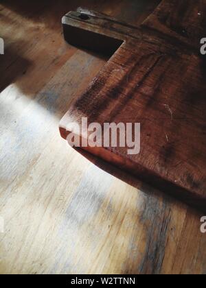 wooden cutting board on table Stock Photo