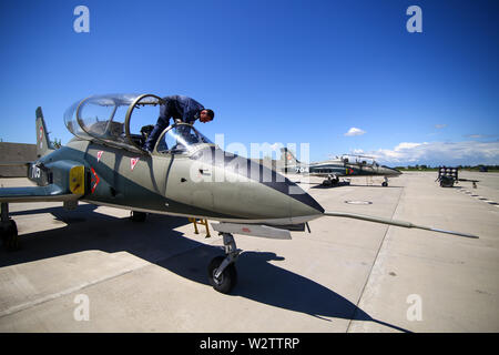 Boboc, Romania - May 22, 2019: Mechanics attend IAR 99 Soim (Hawk) advanced trainer and light attack airplanes, used as jet trainer of the Romanian Ai Stock Photo
