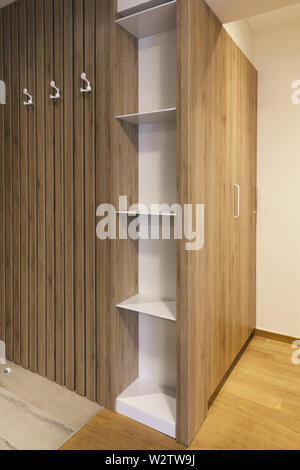 wooden cupboard and shelves in the corridor Stock Photo