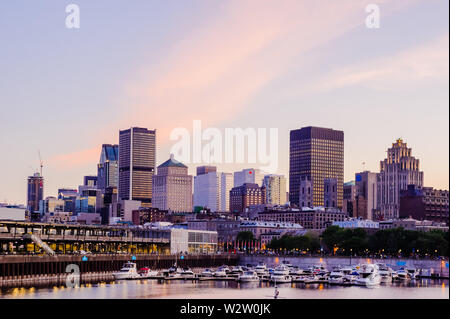 MONTREAL, CANADA - JUNE 15, 2018: The quays and historical old city near the waterfront are a popular tourist area on a summer evening. Stock Photo