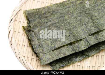 Japanese food, Nori dry seaweed sheets on plate Stock Photo