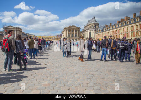 Versailles, France. April 18, 2014. Tourists making a long line to visit Versailles Castle Stock Photo