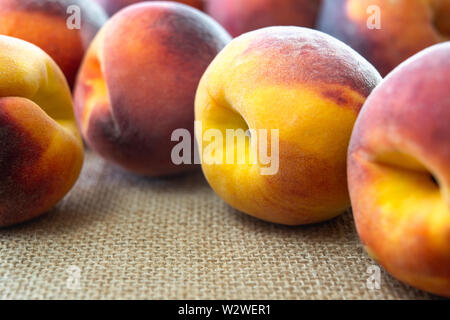 Fresh Ripe Peaches in a Row, Close Up Stock Photo