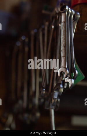 Set of wrenches hanging in a garage Stock Photo