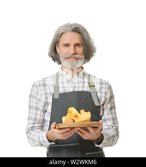 Male owner of cheese store on white background Stock Photo - Alamy