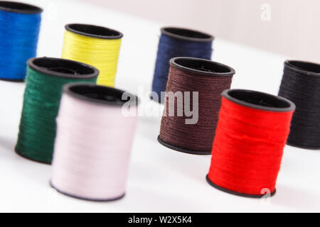 Spools of colorful thread using for needlework, embroidery and sewing Stock Photo