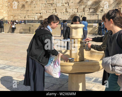 JERUSALEM, ISRAEL - JANUARY 22, 2019: Cranes with water and special ritual Cups for washing hands beside the Wailing Western Wall in Jerusalem Stock Photo