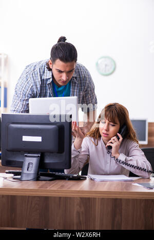 The young male it specialist in the office Stock Photo