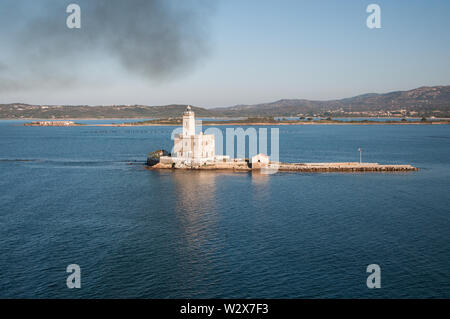 A view of lighthouse in Olbia gulf on sunset hour Stock Photo