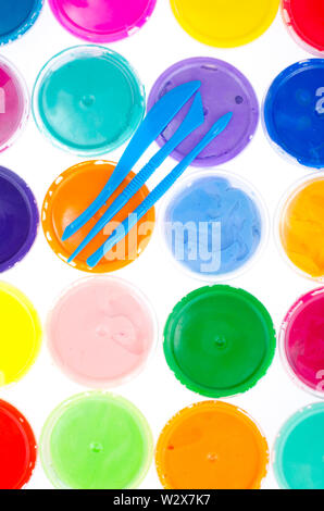 Color plasticine in jars Stock Photo