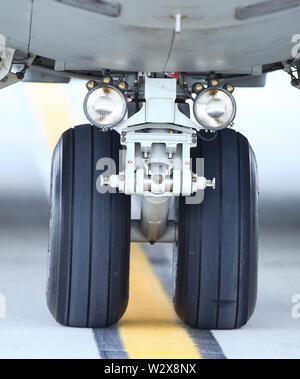 Details of the landing gear of a military cargo plane. Stock Photo