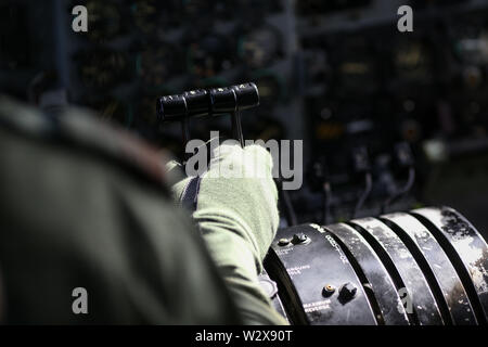 Details with the thrust lever on a military cargo airplane. Stock Photo