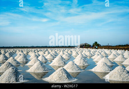 Sea salt farm and barn in Thailand. Organic sea salt. Raw material of salt industrial. Sodium Chloride. Solar evaporation system. Iodine source. Work Stock Photo