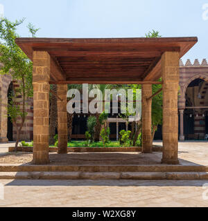 Pergola with four columns and wooden ceiling at courtyard of Amir Aqsunqur Mosque (Blue Mosque), Medieval Cairo, Egypt Stock Photo