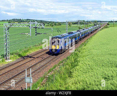 New Scotrail Class 385 EMU trains at Park Farm east of Linlithgow West Lothian Scotland UK heading towards Glasgow from Edinburgh Stock Photo