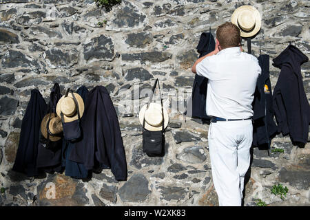 Portugal, Madeira Island, Funchal, Monte, traditional Toboggan riders Stock Photo