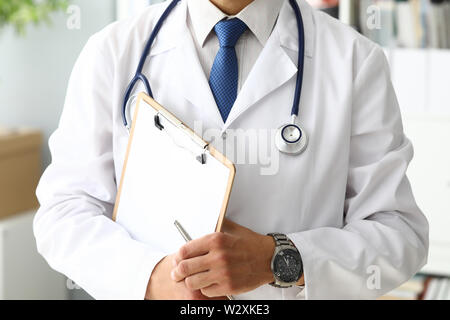 Doctor holding medical clipboard. Office desk concept. Healthcare medicine occupation . Modern space profession education Stock Photo