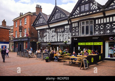The independent bookshop and cafe with Enzo cafe next door in Elizabethan wooden framed buildings in Nantwich, Cheshire, UK Stock Photo