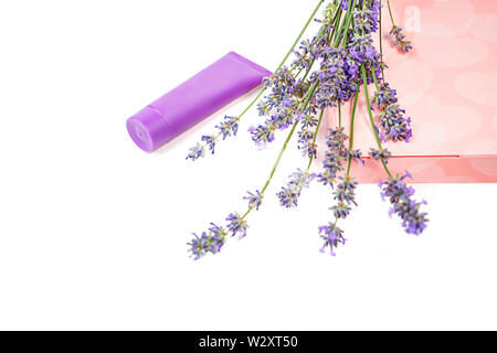 Cosmetic cream and lavender flowers, gift box with sweets on white background, isolated Stock Photo