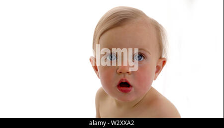 Portrait of a surprised baby with big blue eyes Stock Photo