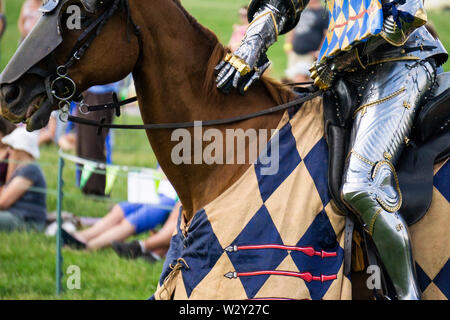 A medieval knight sitting on a horse wearing shining armour Stock Photo ...