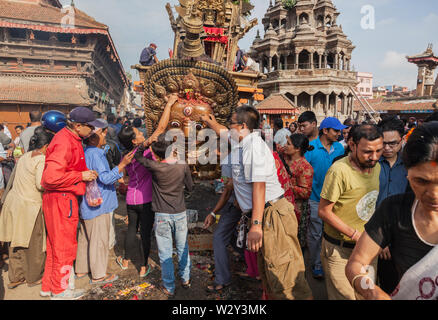 Giving prayer at the Rato Machindranath Chariot festival in Kathmandu Stock Photo