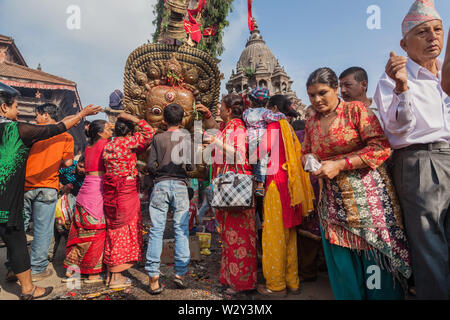 Giving prayer at the Rato Machindranath Chariot festival in Kathmandu Stock Photo