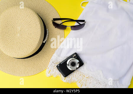 Travel concept with top, straw hat, sunglass, camera. Stock Photo