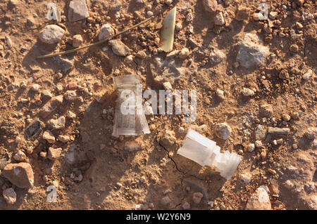 Remains of plastics falling shotgun rifles when fired by hunters in the field Stock Photo