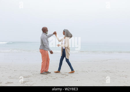 Couple dancing at the beach Stock Photo