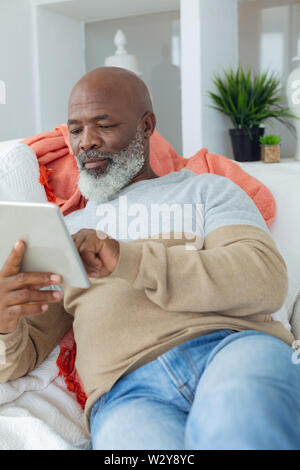 Man using digital tablet Stock Photo