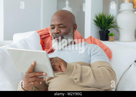 Man using digital tablet Stock Photo