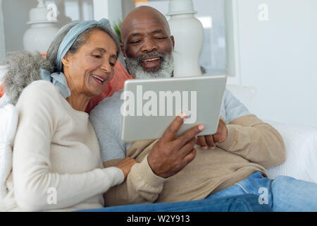 Couple using digital tablet Stock Photo
