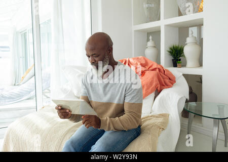 Man using digital tablet Stock Photo