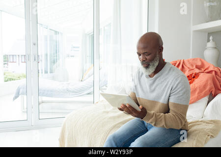 Man using digital tablet Stock Photo