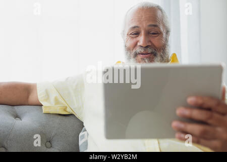 Man using digital tablet Stock Photo