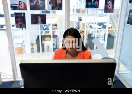 Female graphic designer working on computer Stock Photo