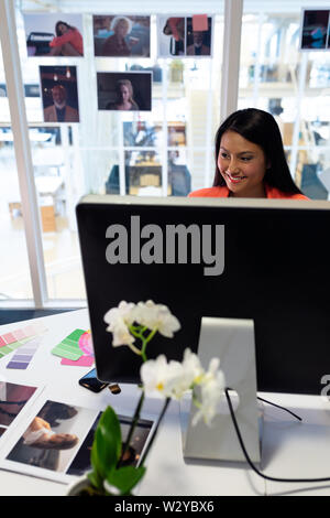 Female graphic designer working on computer Stock Photo