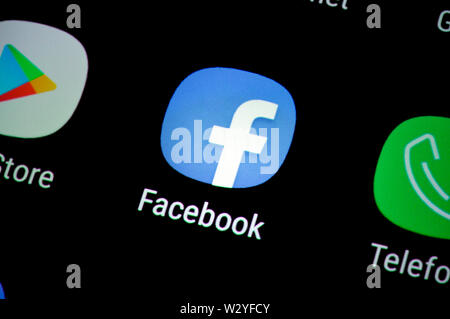 facebook logo on a smartphone display Stock Photo - Alamy