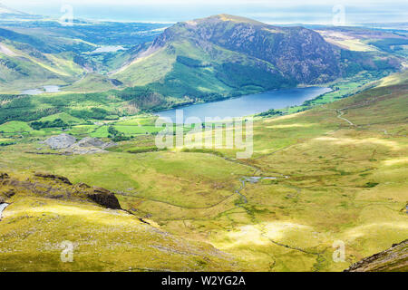 Track to Snowdon summit taking ranger path, North Wales, United Kingdom, view of the mountains, lake from the above, selective focus Stock Photo