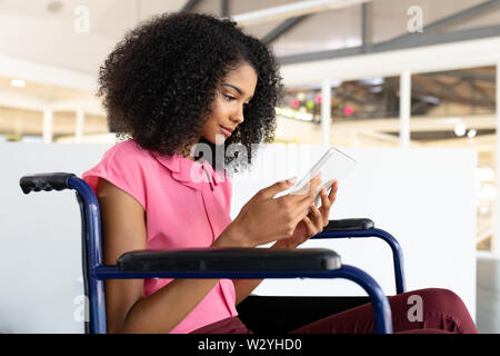 Female graphic designer using digital tablet in office Stock Photo