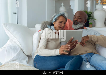 Couple using a digital tablet Stock Photo